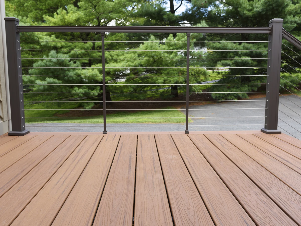 Wooden deck with metal railings treated with deck stain in Chesterfield