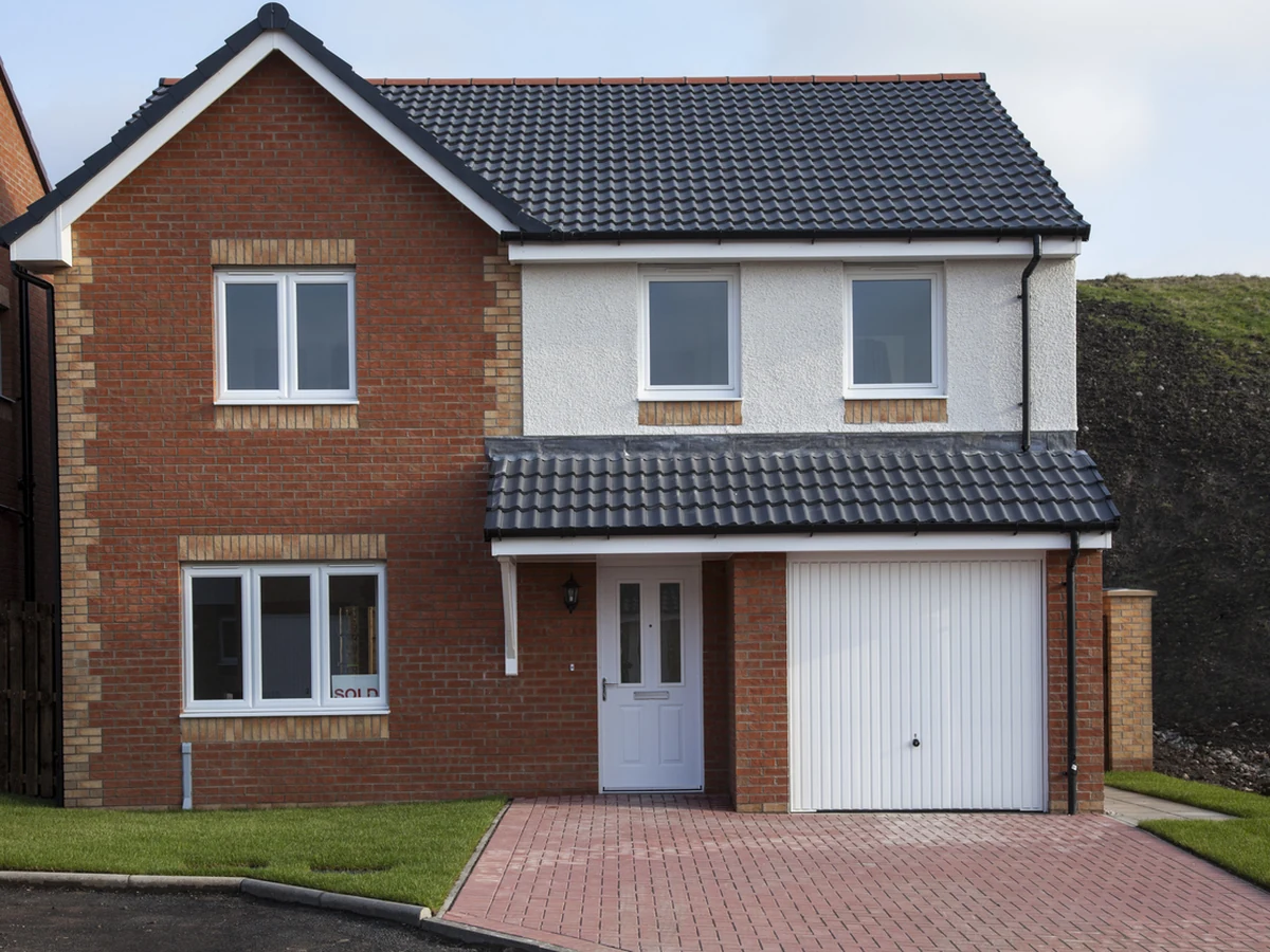Exterior painting on a brick detached house in Chesterfield by Chesterfield Decorators