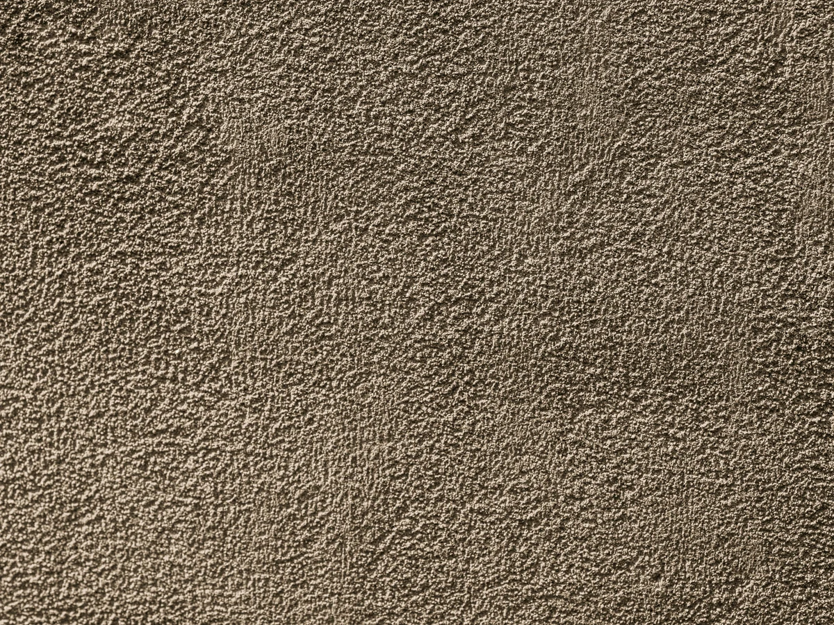 Exterior painting closeup on rough textured render in Ripley by Chesterfield Decorators