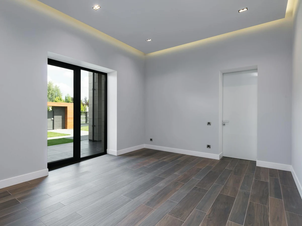 Empty grey room interior painting in Wingerworth by Chesterfield Decorators