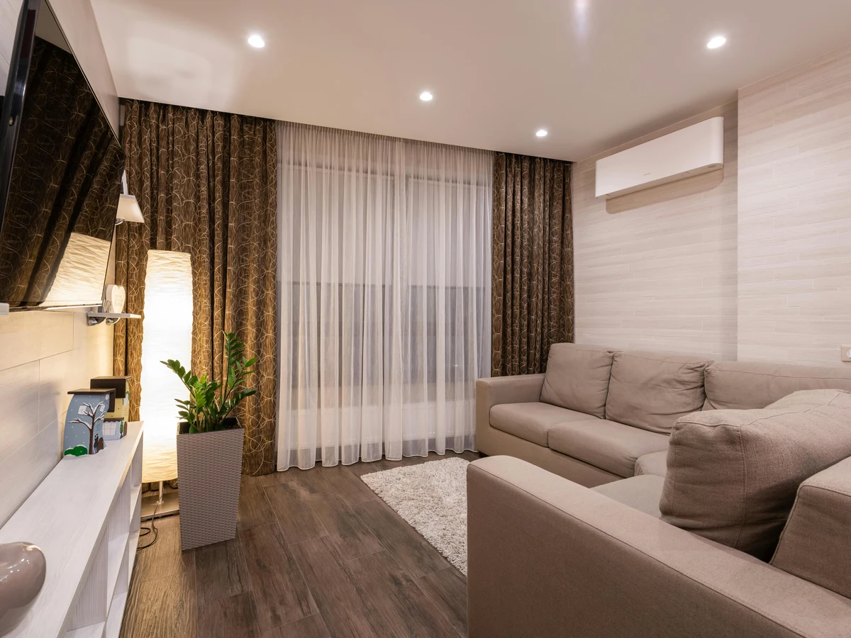 Feature wall painting in a beige living room in Chesterfield by Chesterfield Decorators