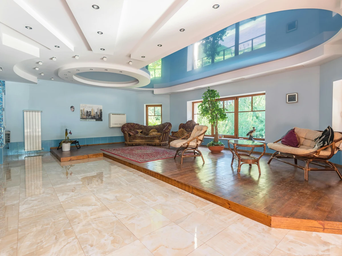 Large blue feature wall in an open-plan room painted by Chesterfield Decorators