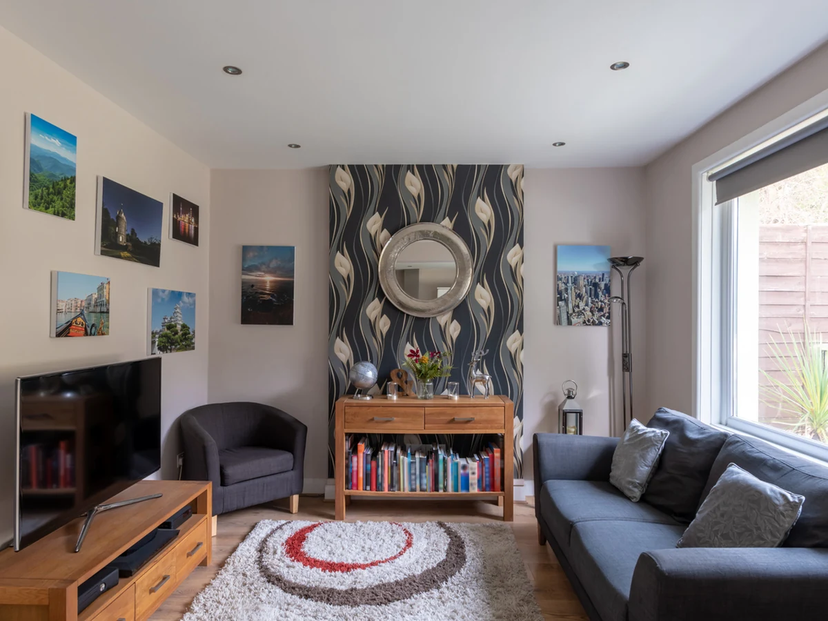 Lounge with feature wallpaper installed in Chesterfield by Chesterfield Decorators