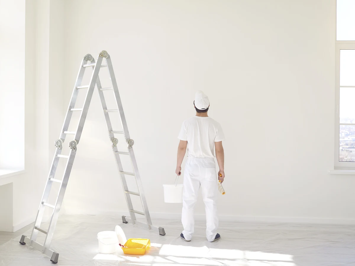 painting-decorating-painter-white-ladder-chesterfield-decorators Painter on white ladder working on Grassmoor property by Chesterfield Decorators