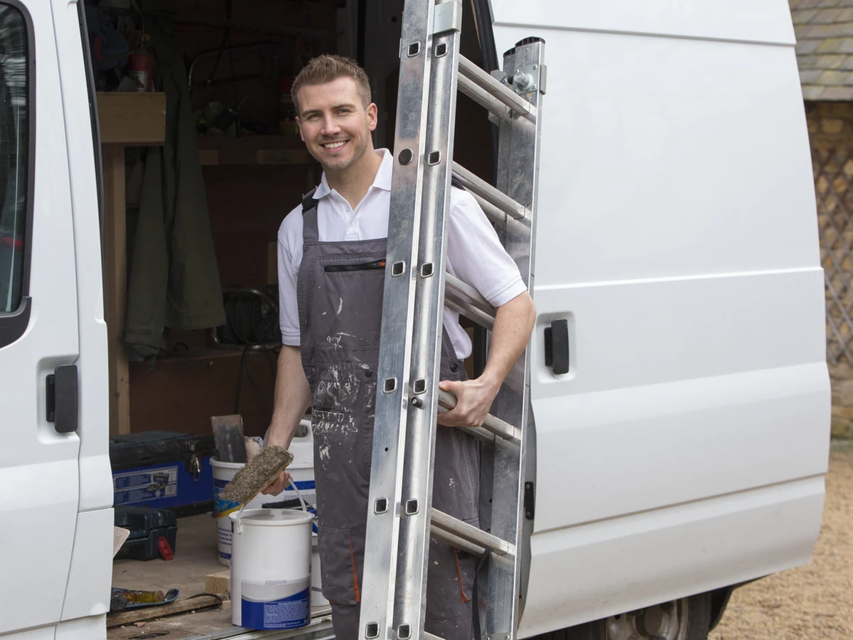painting-decorating-smiling-decorator-ladder-chesterfield-decorators Painter and decorator on ladder in Walton Chesterfield by Chesterfield Decorators, professional decorating services