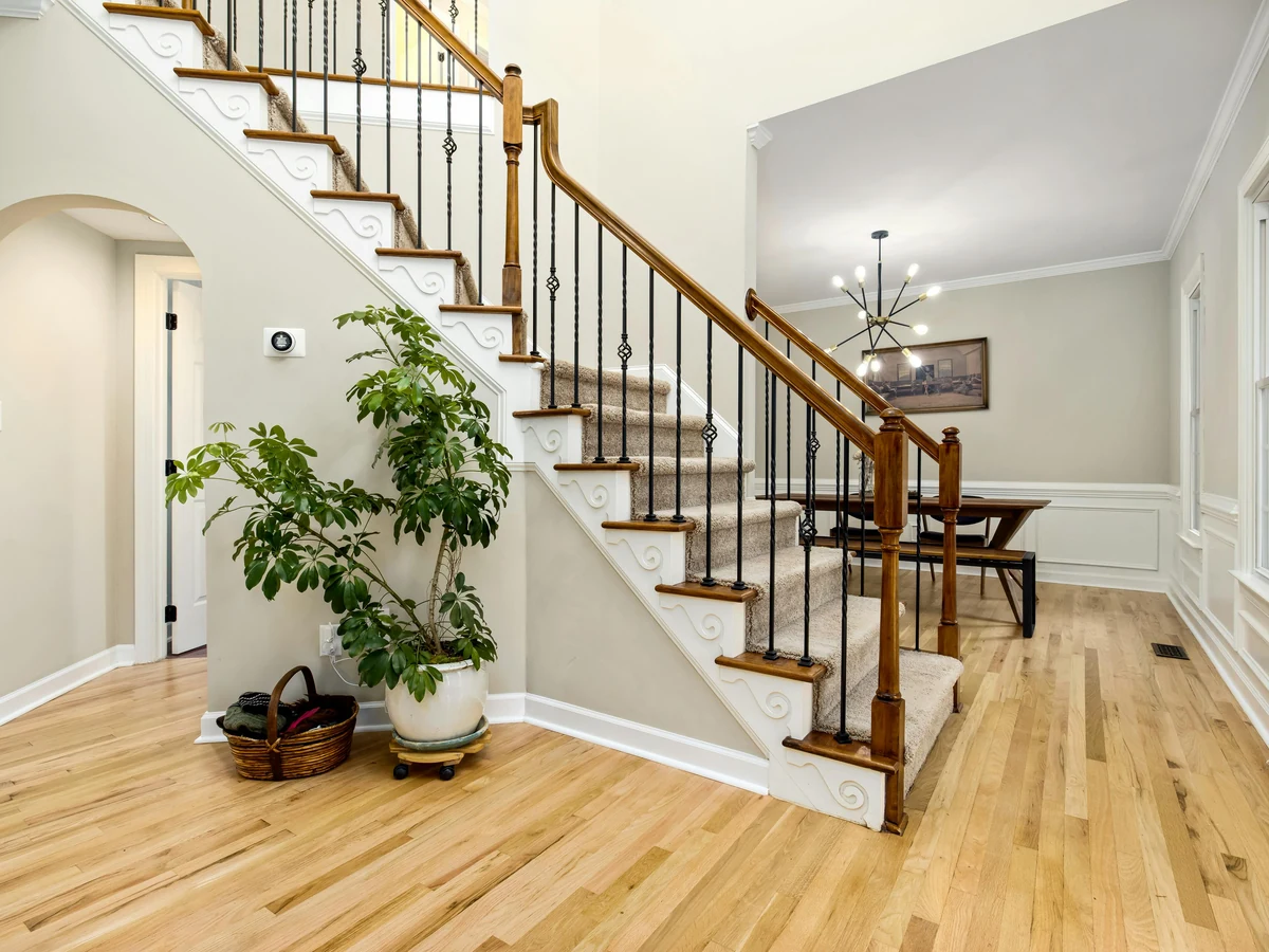 Traditional staircase wood painting by Chesterfield Decorators, interior hardwood staining