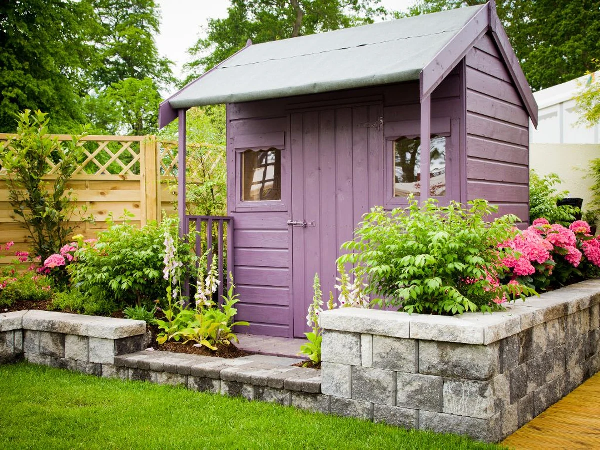 Purple painted wooden garden structure in Chesterfield by Chesterfield Decorators