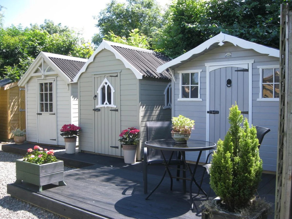 Shed painting in Chesterfield by Chesterfield Decorators, two freshly painted timber garden sheds